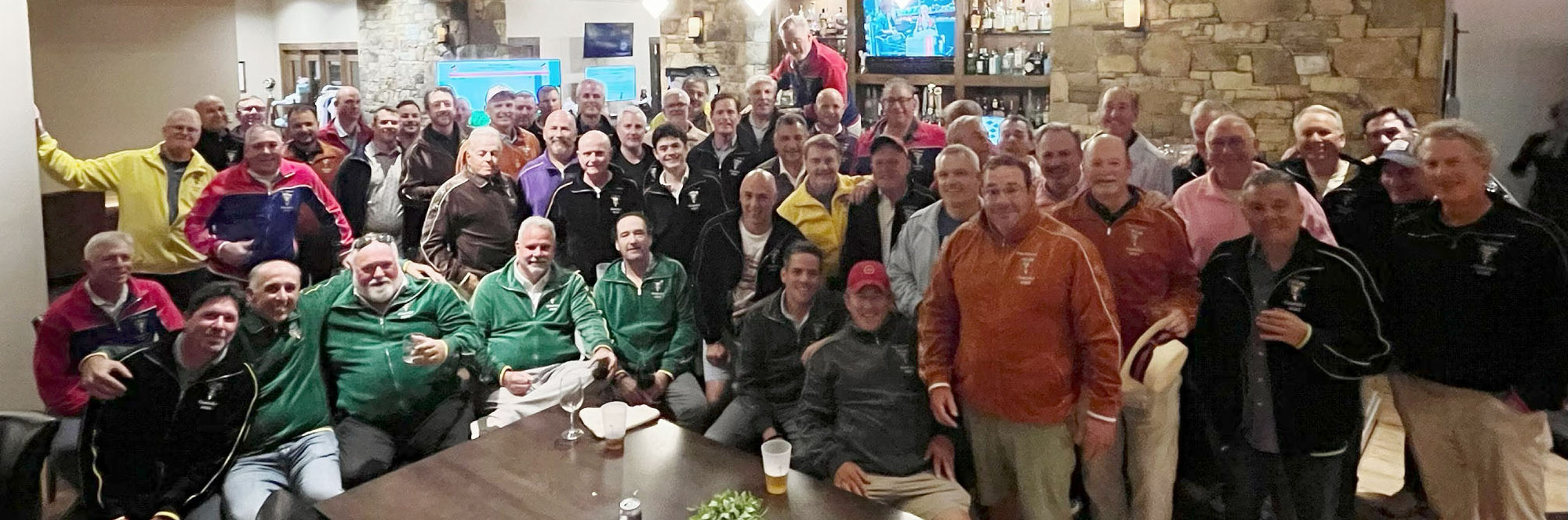 A group of guys in a bar wearing velour jackets by Sweatsedo