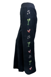 Black Velour lounge pants with rhinestone art down the arms and legs.  A margarita glass, high heel shoes and music notes.  A fun black velour tracksuit.