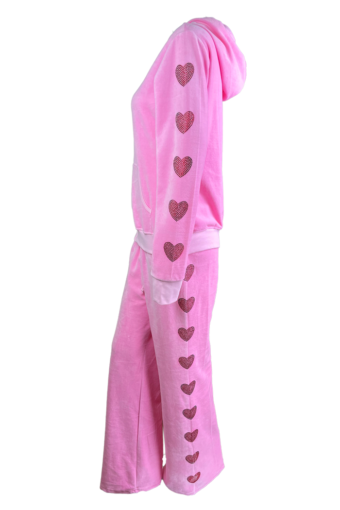 pink velour tracksuit with red rhinestone hearts down the arms and legs.  2 piece velour sweatsuit with custom rhinestones.