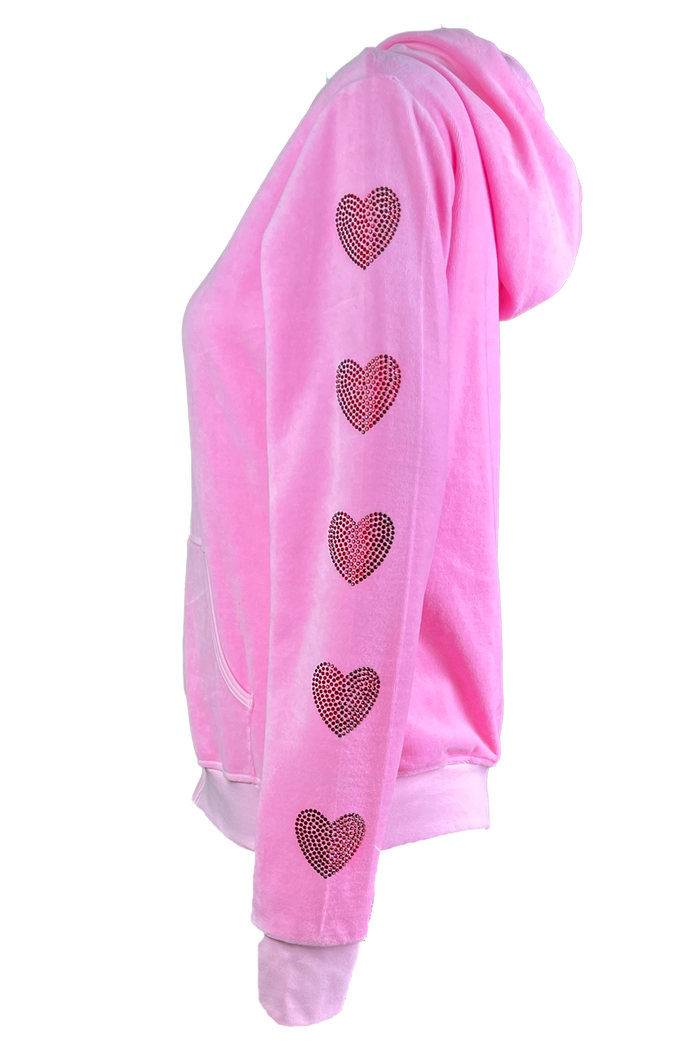 pink velour track jacket with red rhinestone hearts down the arms and legs.   Velour sweatshirt with custom rhinestones.