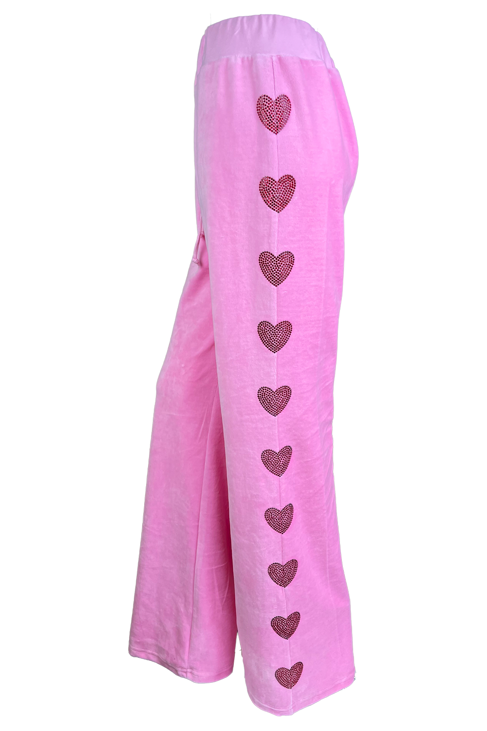 pink velour trackpants with red rhinestone hearts down the arms and legs.  Velour sweatpants with custom rhinestones.